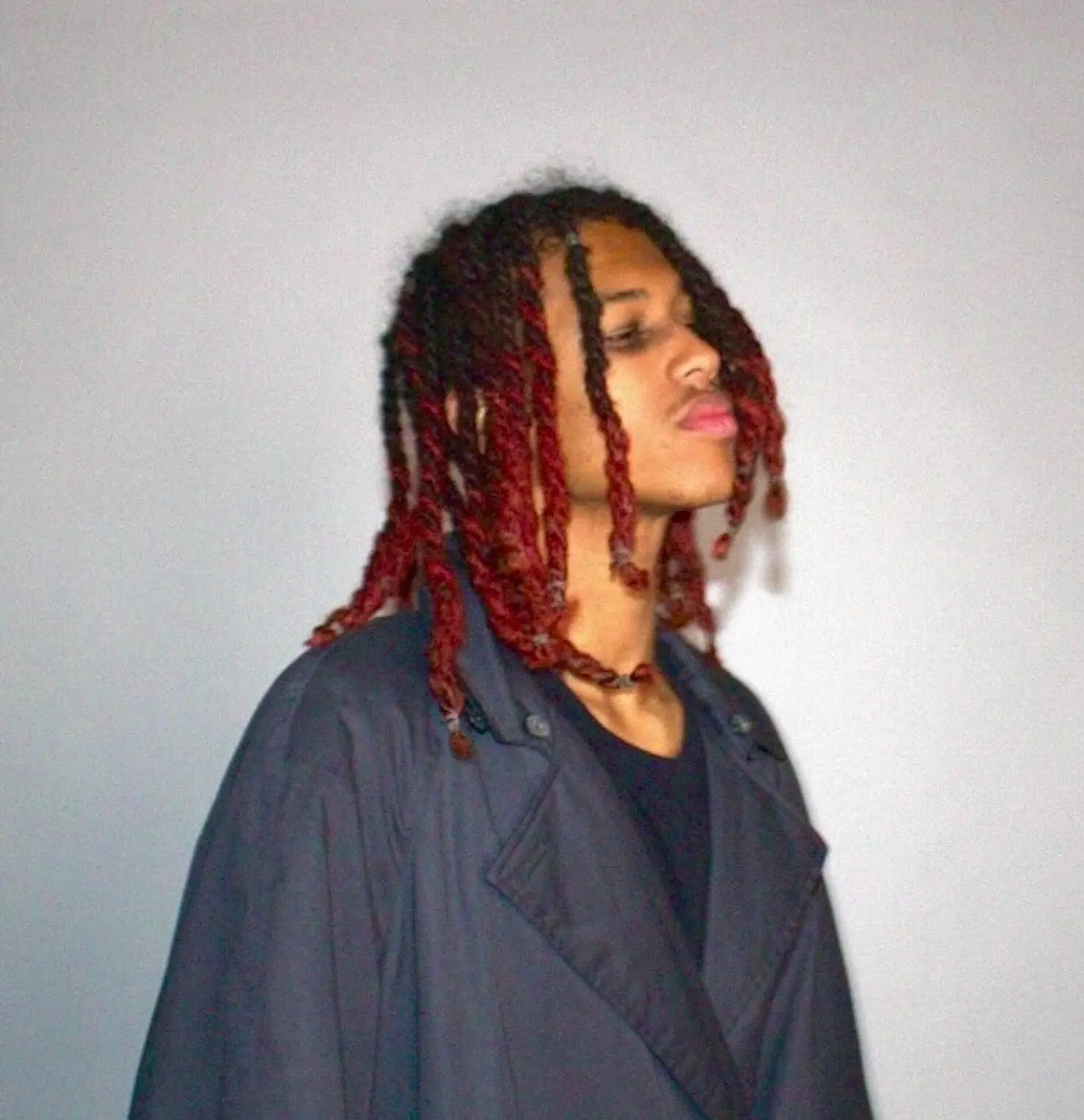 Portrait of Dappie in an oversized navy coat