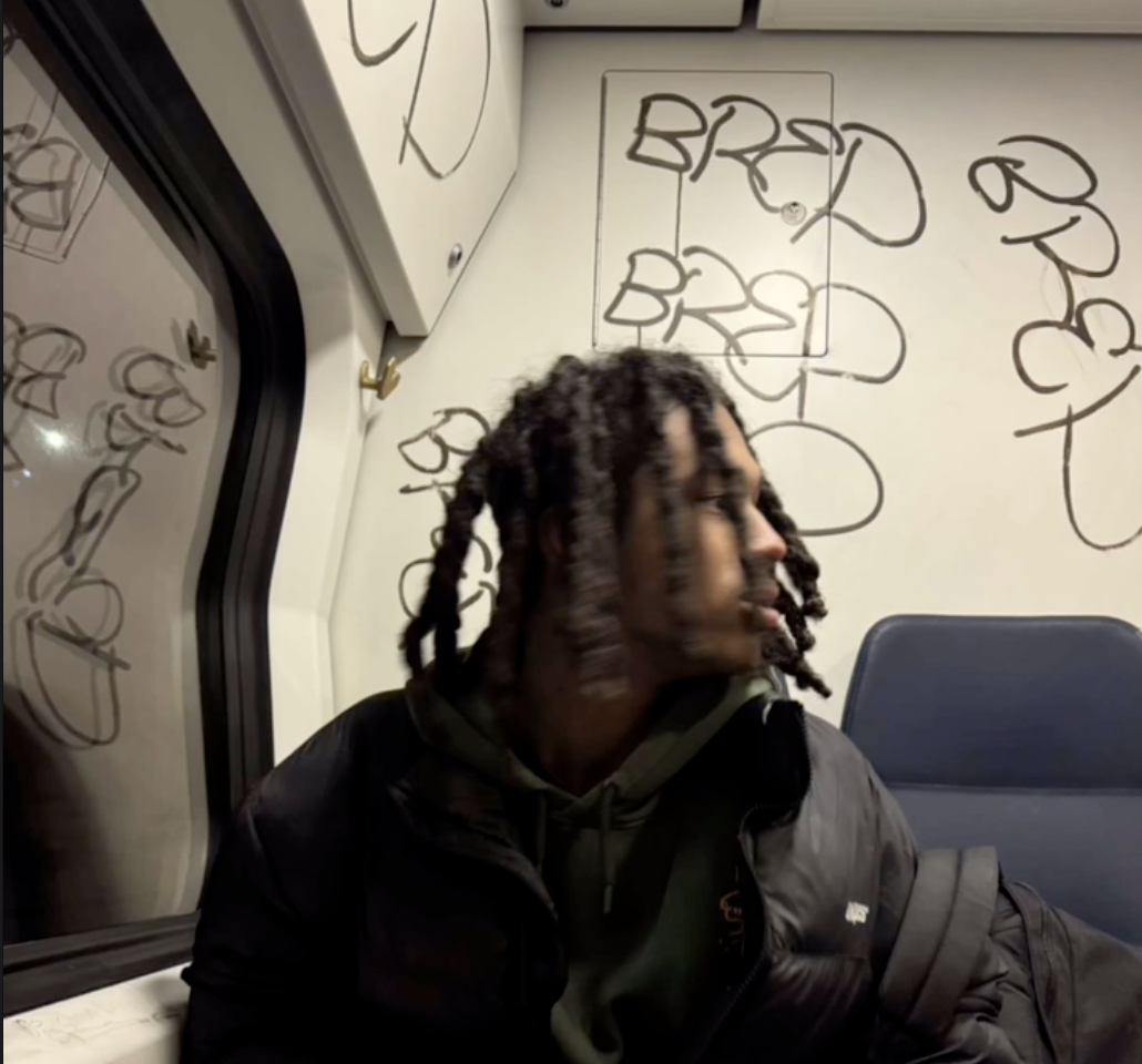 Dappie on a graffiti-tagged night train